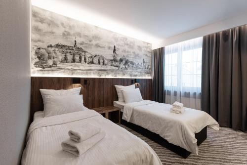 Llit o llits en una habitació de Artis Hotel & Spa