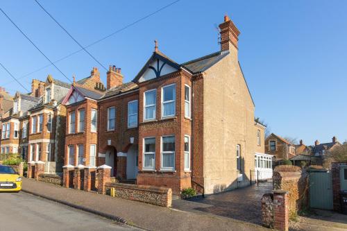 a large brick house on the side of a street at Fabulous Seaside Retreat in Hunstanton