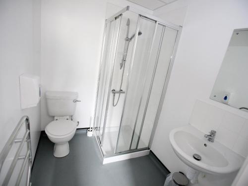 a bathroom with a shower and a toilet and a sink at YHA Alnwick - Partner in Alnwick