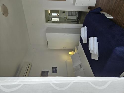 a room with a bed with towels on it at Rooms Falcon in Brist