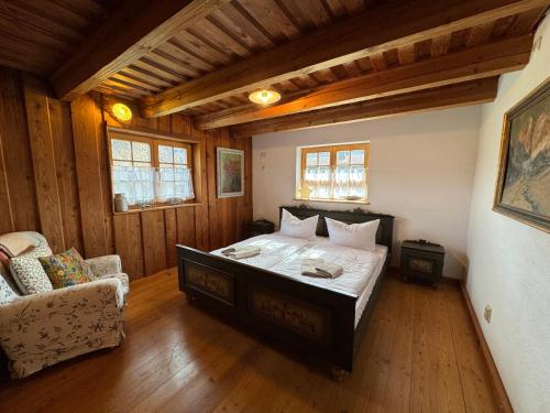 a bedroom with a large bed in a room at Haus Bergsteigerglück in Schleching