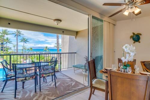 a dining room with a view of the ocean at Hale Ono Loa 204 in Lahaina