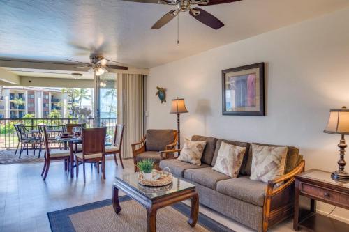 a living room with a couch and a table at Hale Ono Loa 204 in Lahaina