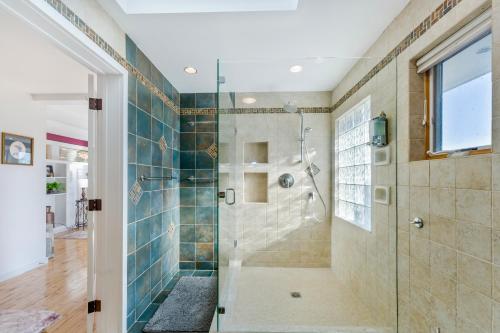 a bathroom with a shower with a glass door at Heritage Hollow in Cambridge