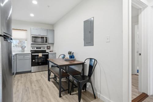 a kitchen with a table and chairs in a room at 2 Bedroom Unit in Corpus Christi