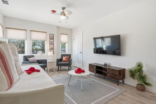 a living room with a couch and a tv at 2 Bedroom Unit in Corpus Christi