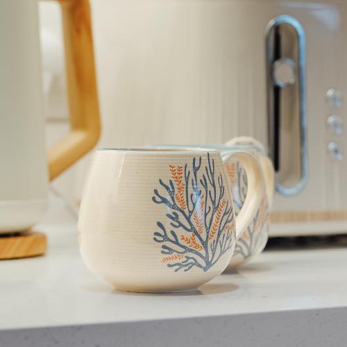 a cup sitting on top of a counter at The Wee Harbour Home in Anstruther