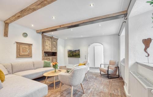 a living room with a couch and a table at Munkler Mühle Whg 1 in Irrhausen