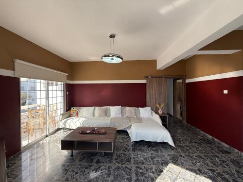 a bedroom with a bed and a table at The Family House in Larnaca