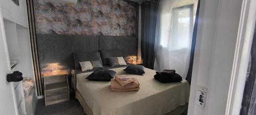 a bedroom with a bed with a purse on it at γαληνη in Vamos