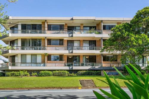 an apartment building with balconies and a street at Quarterdeck 9 in Port Macquarie
