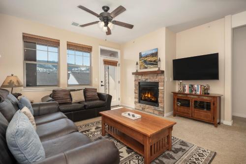 a living room with a couch and a fireplace at Ten Mile G201 in Granby