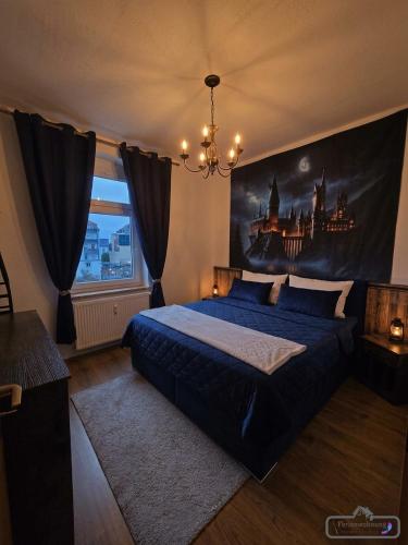 a bedroom with a bed with a painting on the wall at Magische Welt in Bautzen