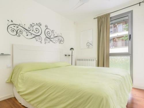 a white bedroom with a large bed and a window at Terraza Varellas in Latas