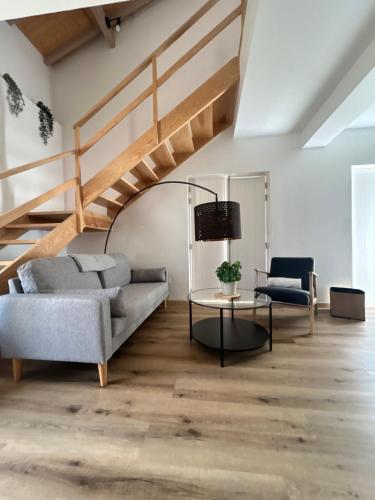 a living room with a couch and a table at Villa Ribeirinho Stays - 4 Bedrooms in Porto