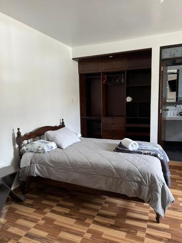 a bedroom with a large bed in a room at Menacho's House in Caraz