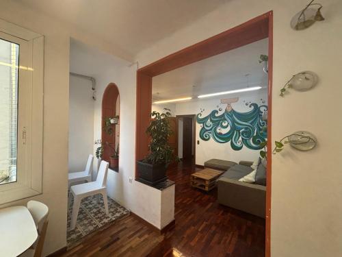 a living room with a couch and a table at Tarragona Hostel in Tarragona