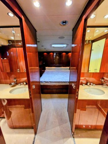 a bathroom with two sinks and two mirrors at Private Yacht Monaco in Monte Carlo