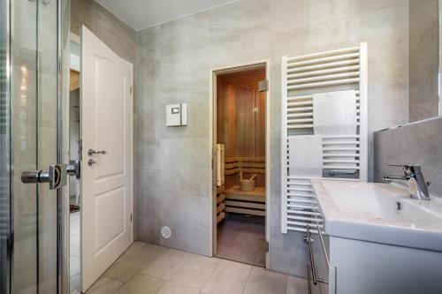 a bathroom with a sink and a toilet at Stine in Prerow