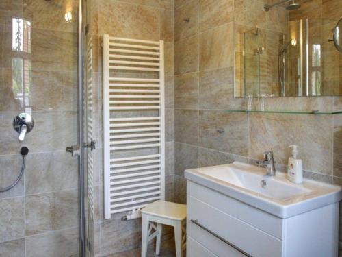 a bathroom with a shower and a sink and a shower at Strandhus in Prerow