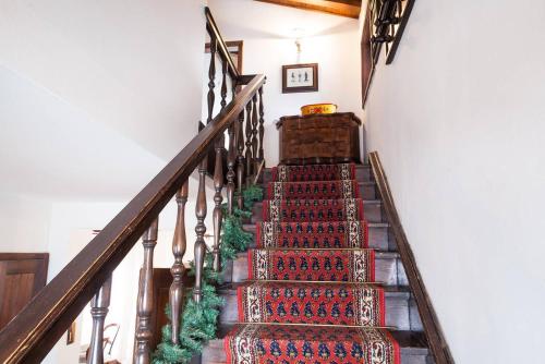 a staircase in a house with a bunch of carpet at Casa Remo 1 in San Vito di Cadore