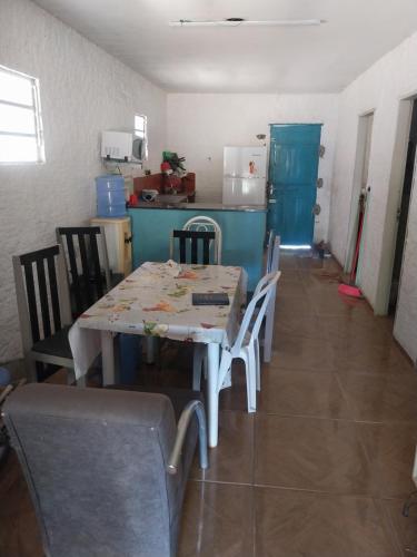 a kitchen with a table and chairs in a room at Sitio de Antonio à 18km do parque do povo in Campina Grande