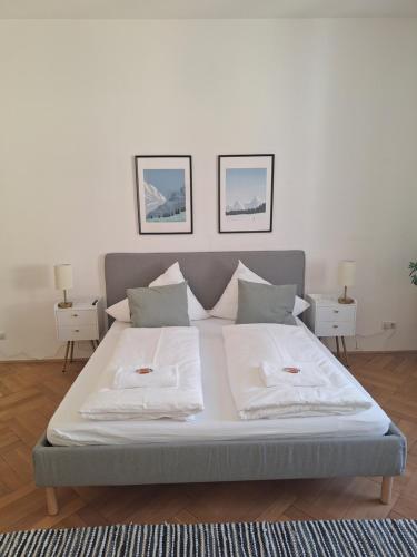 a bed with two pillows on it in a bedroom at Innsbruck Residence in Innsbruck