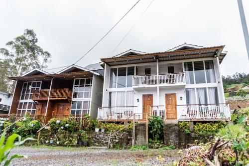 a house on the side of the road at Altura Cabin Dieng in Diyeng