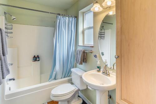 a bathroom with a sink and a toilet and a tub at Explore the Coconino Forest! Flagstaff Cottage in Flagstaff