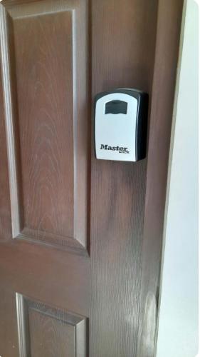 a toaster on the door of a refrigerator at Persimmon Studios - Studio Unit- 16th Floor - 1641 in Cebu City