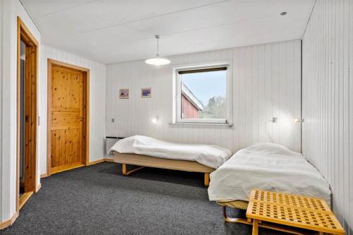 a bedroom with two beds and a window at JB380-Fjerritslev-Gottrupvej-311-C in Fjerritslev