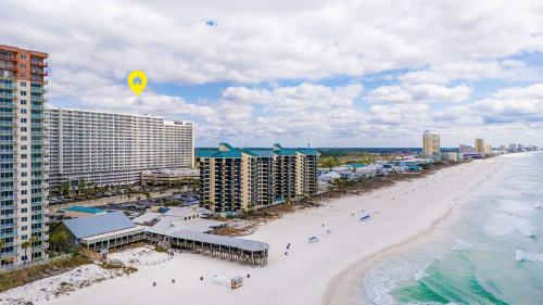 an aerial view of a beach with hotels and the ocean at Steps to the Sand - 1BR Condo in Panama City Beach