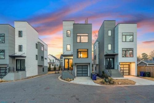a rendering of a house at sunset at Sleeps 8 - Rooftop Deck - Prime Location in Raleigh
