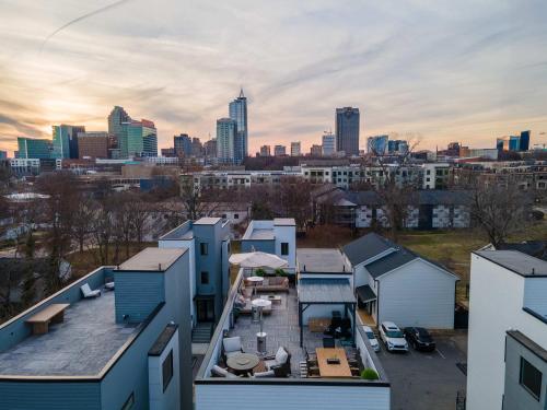 a view of a city skyline with buildings at Sleeps 8 - Rooftop Deck - Prime Location in Raleigh