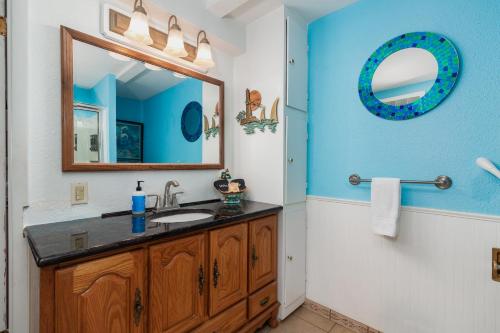 a bathroom with a sink and a mirror at Waldport Beach Haven in Waldport