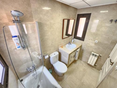 a bathroom with a toilet and a sink and a shower at RodaGolf Resort Nice Views in San Javier