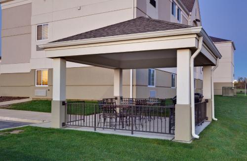 a gazebo in front of a house at Candlewood Suites - Peoria at Grand Prairie by IHG in Peoria
