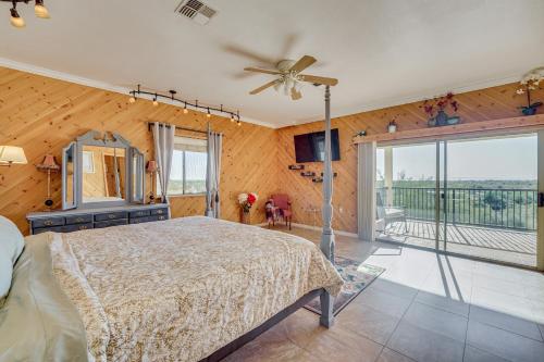 a bedroom with a bed and a ceiling fan at Private Hot Tub & Epic Views in Superstition Mtns! in Apache Junction