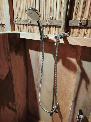 a shower in the corner of a building at Kafdarun Homestay in Dokkor