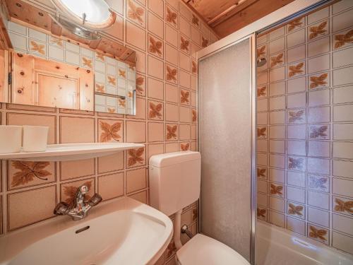 a bathroom with a toilet and a sink and a shower at Andre Top 2 in Wald im Pinzgau