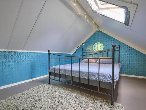 a bedroom with a bed in a attic at Design Lodge Twente in Haaksbergen