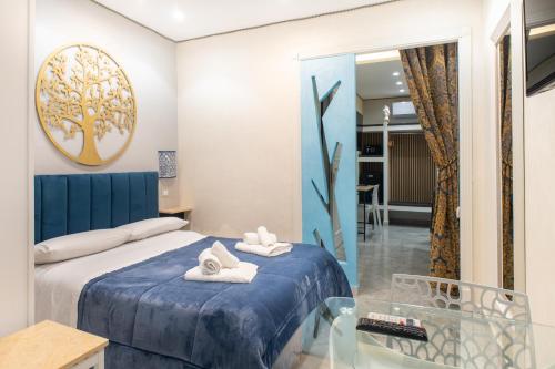 a bedroom with a bed and a glass table at Federico 70 Rubino in Palermo