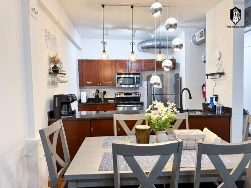 a kitchen and dining room with a table and chairs at The Stallion in Memphis