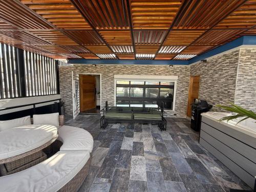 a living room with two beds and a table at propiedad para pasarla bien in La Grúa