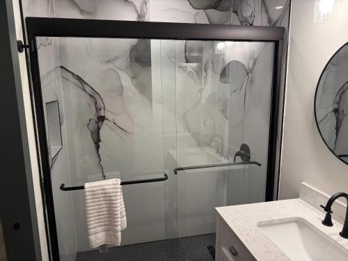 a shower with a glass door in a bathroom at Ramada by Wyndham Albany GA in Albany