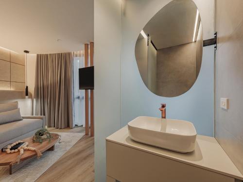 a bathroom with a sink and a mirror on a counter at Devú in Medellín