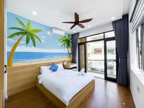 a bedroom with a bed with a palm tree mural at Louis Home in Danang