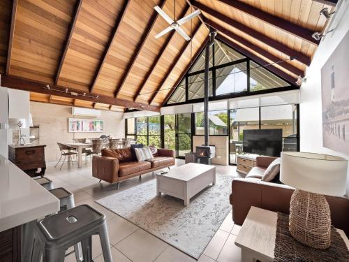 an open living room with a vaulted ceiling at Whalers Cove Villas in Dunsborough