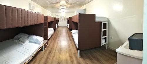 a dorm room with bunk beds and a sink at PNAF Farm resort in Pililla