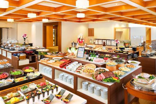 a buffet line with many different types of food at グリーンピア三陸みやこ in Miyako